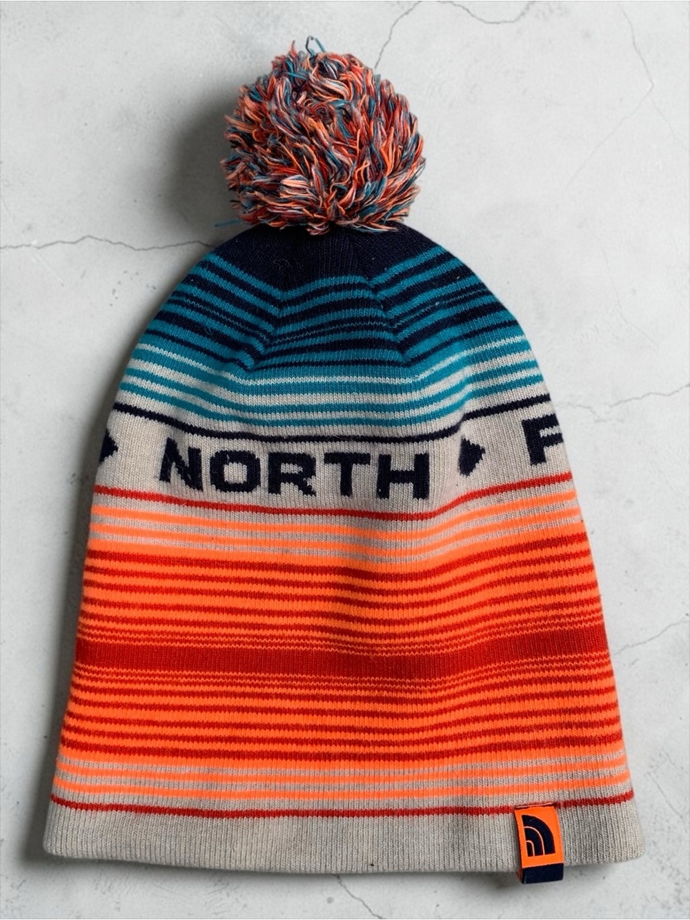 The North Face Kids Striped Pom Beanie Hat - Orange & Blue